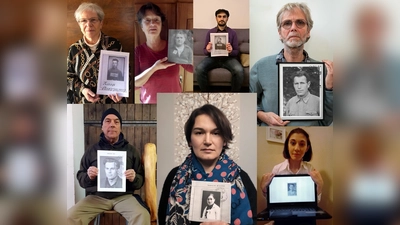 Als Zeichen der Unterstützung halten Menschen aus Erding und Umgebung die Gesichter der Betroffenen hoch. (Foto: Falk Messerschmidt)